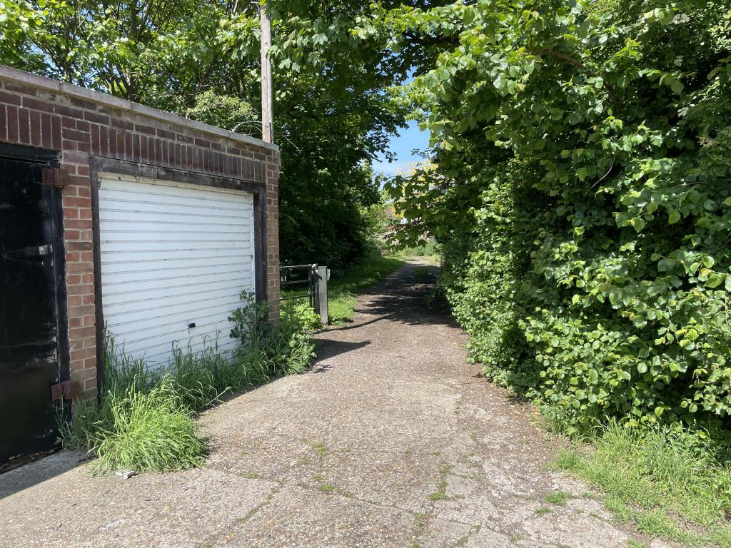 Lot: 48 - PARCEL OF LAND IN RESIDENTIAL AREA - Outside image of access point from Barnes Cray Way to access road